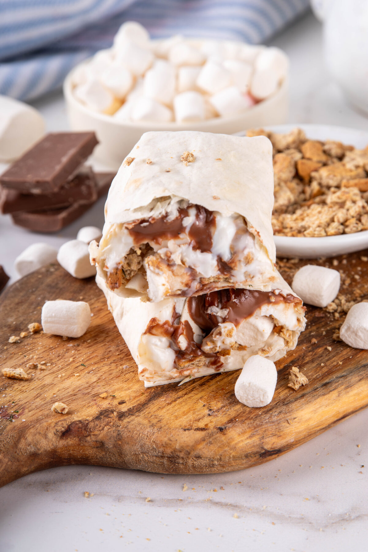 Homemade Air Fryer S'mores with melted chocolate, marshmallows and crumbled graham crackers