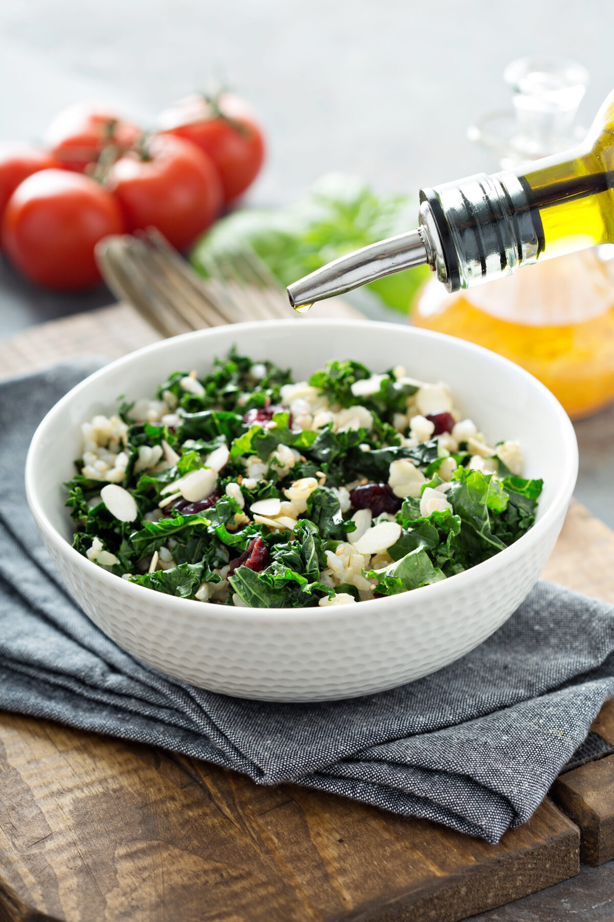 Warm Kale Salad Drizzled with Olive Oil with Brown Rice, Almonds and Dried Cranberries