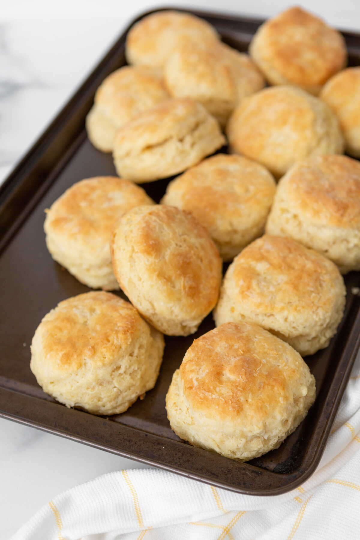 Freshly Baked Homemade Buttermilk Biscuits on a baking sheet
