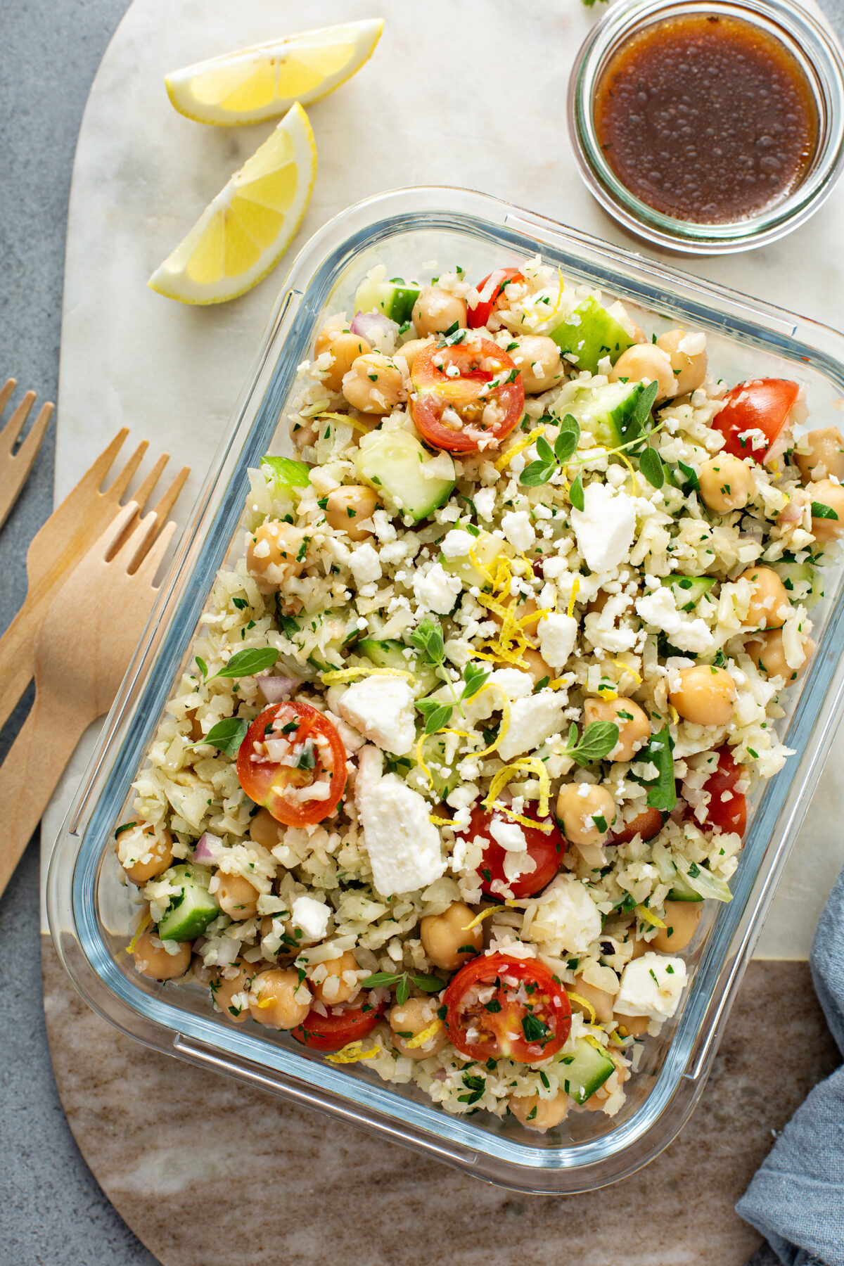 easy greek couscous salad in a meal prep container