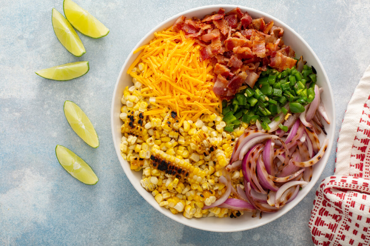 Grilled corn and jalapeno salad with red onion, cheddar cheese and bacon