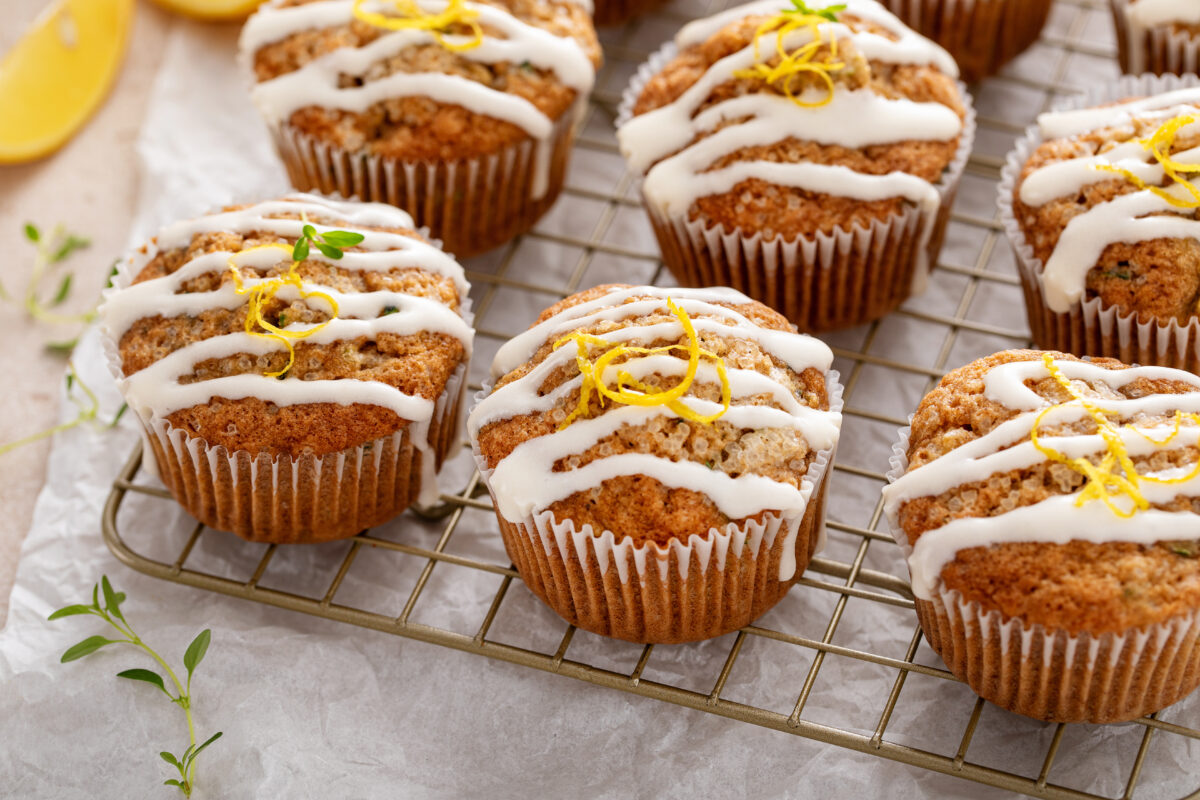 Lemon zucchini muffins with thyme and drizzled with cream cheese glaze