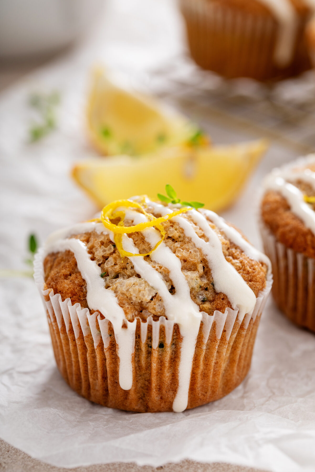 lemon zucchini muffins with fresh thyme and cream cheese glaze