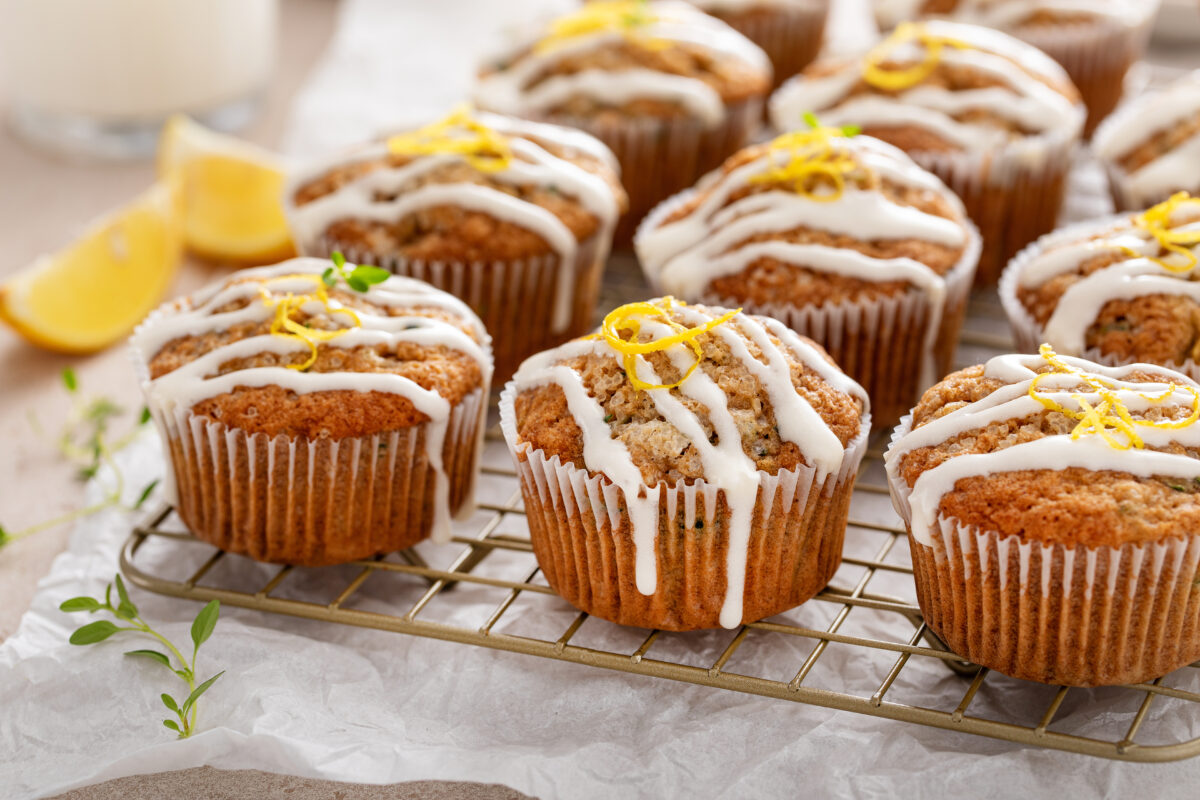 healthy lemon zucchini muffins with glaze and fresh lemon zest
