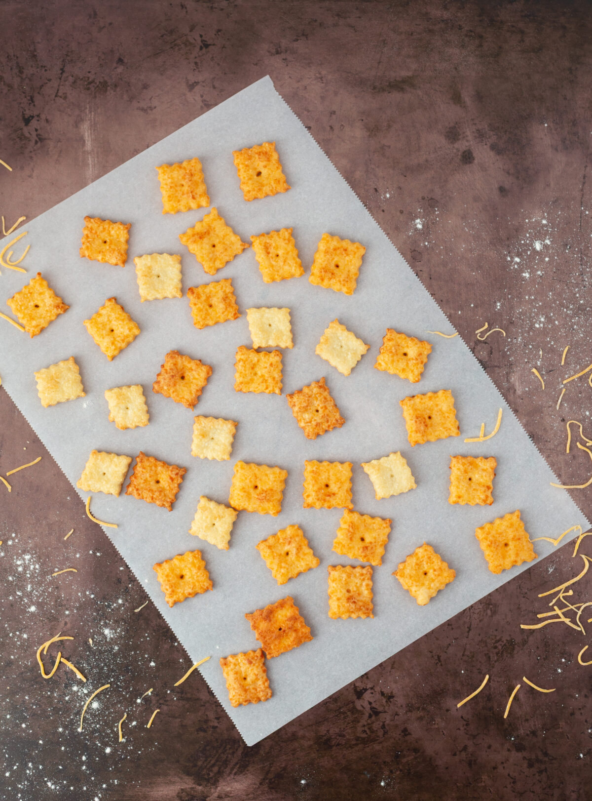 healthier homemade cheese crackers on parchment paper