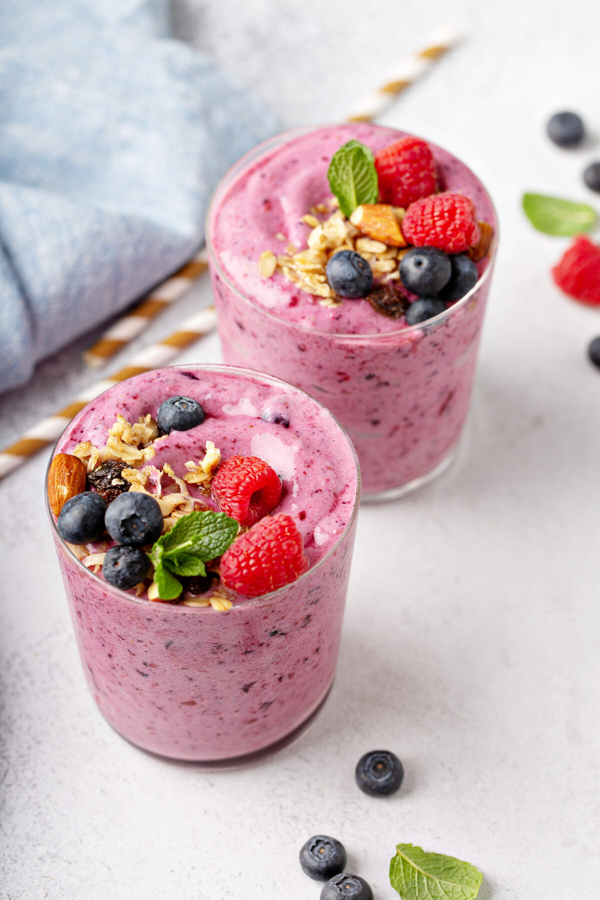 Fresh mixed berry smoothie topped with granola