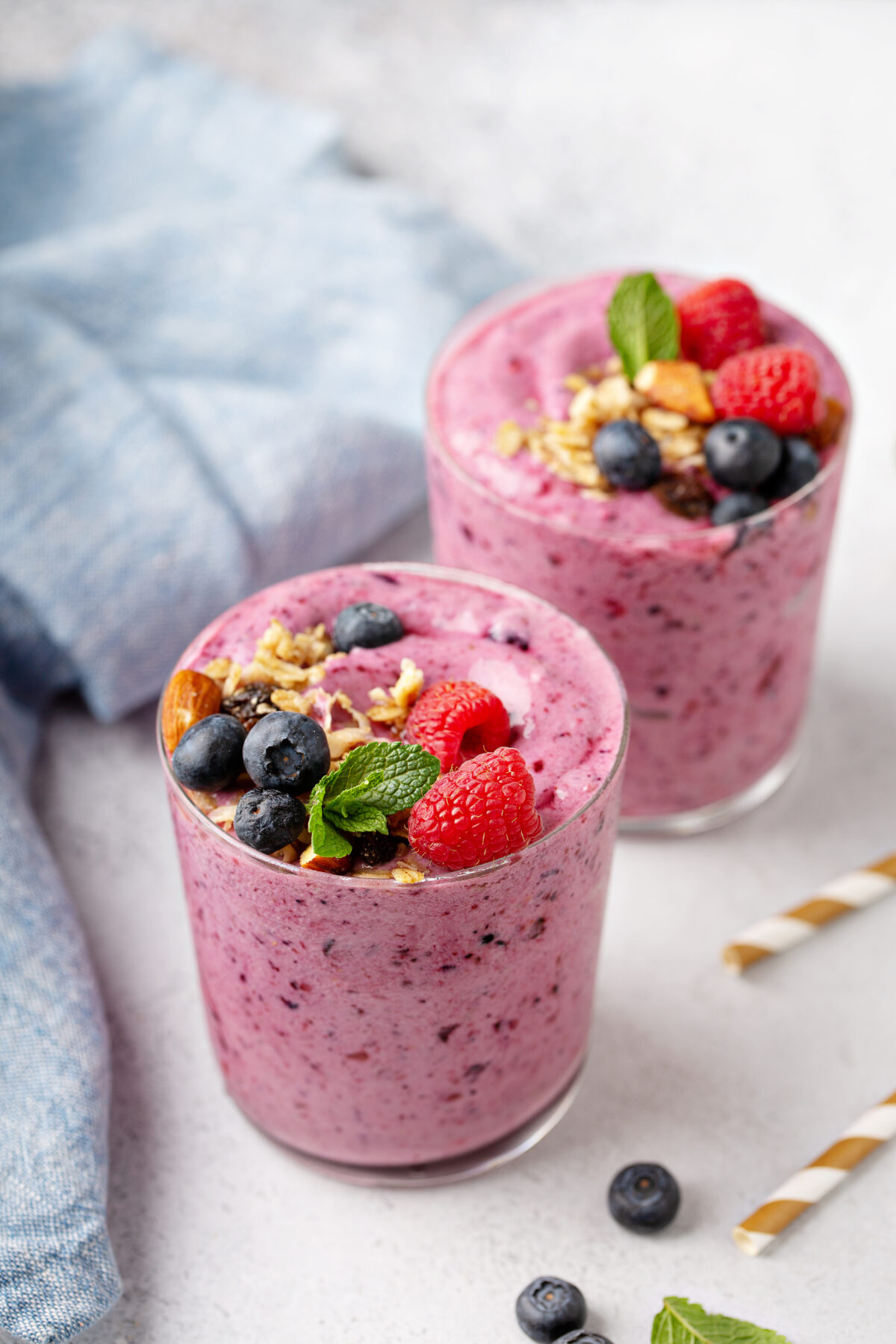 Fresh mixed berry smoothie topped with granola
