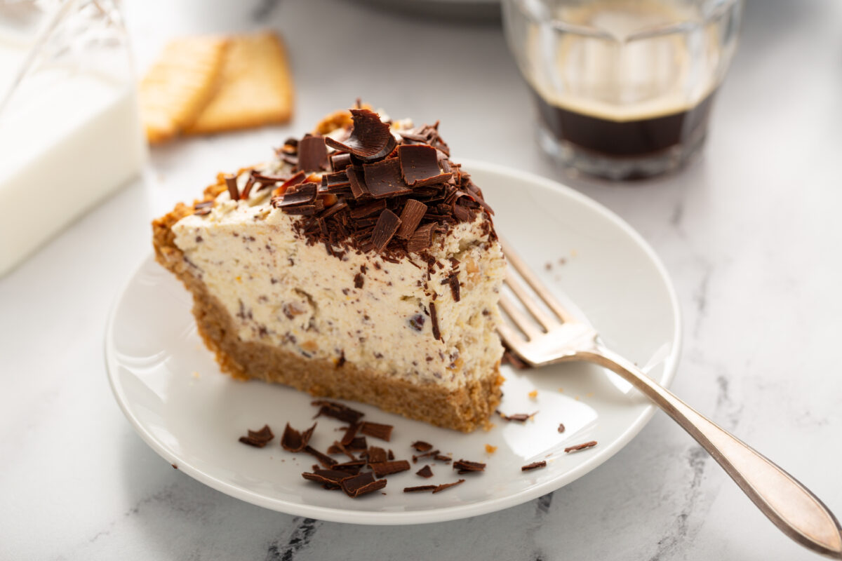 toffee ice cream pie on a serving plate with a fork