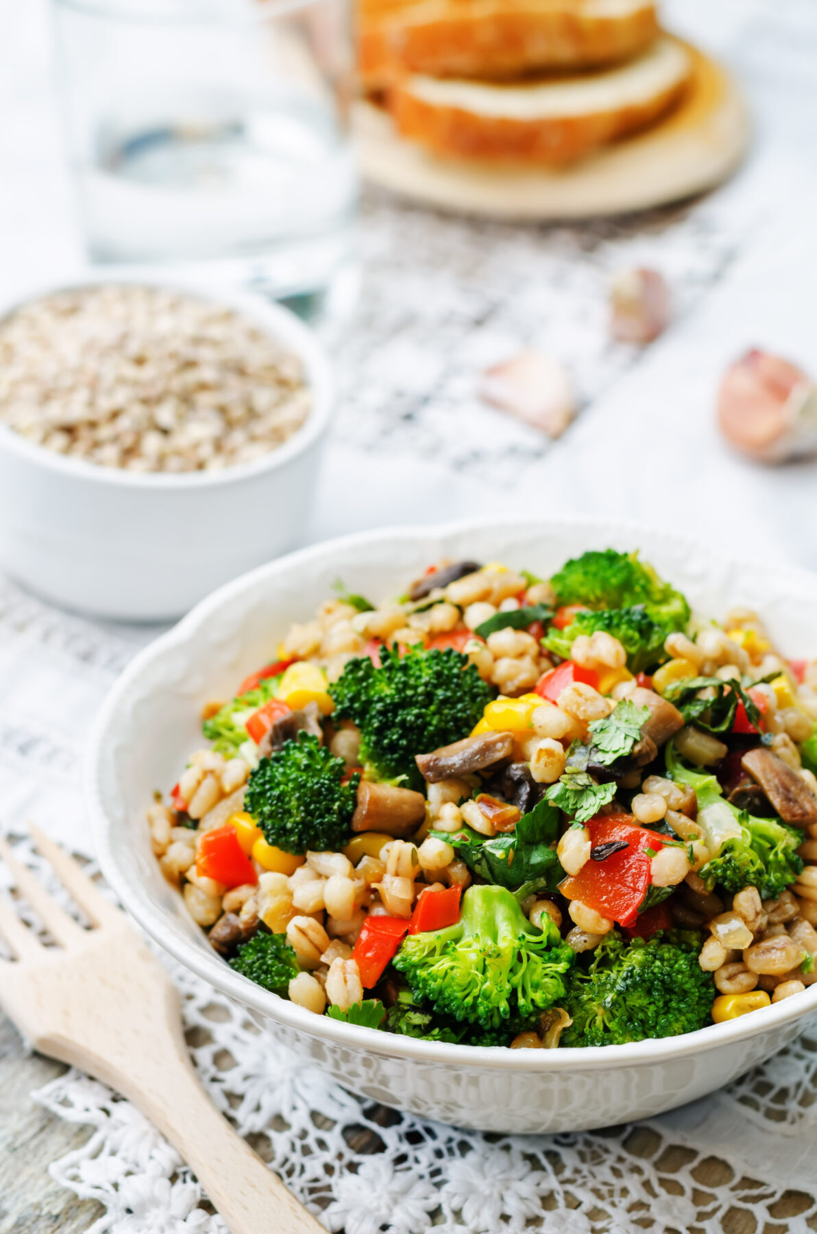 barley salad with roasted vegetables in a serving bowl
