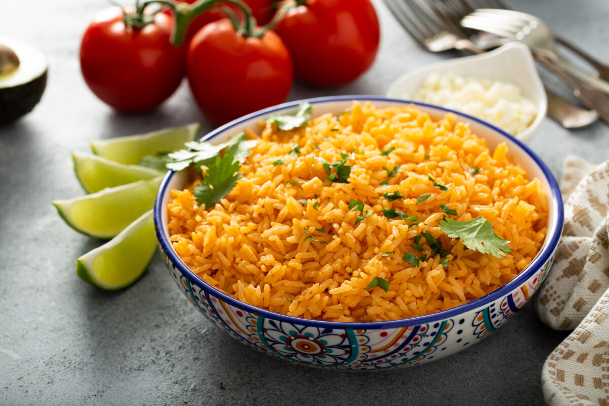Mexican rice with tomatoes and onion served with cilantro