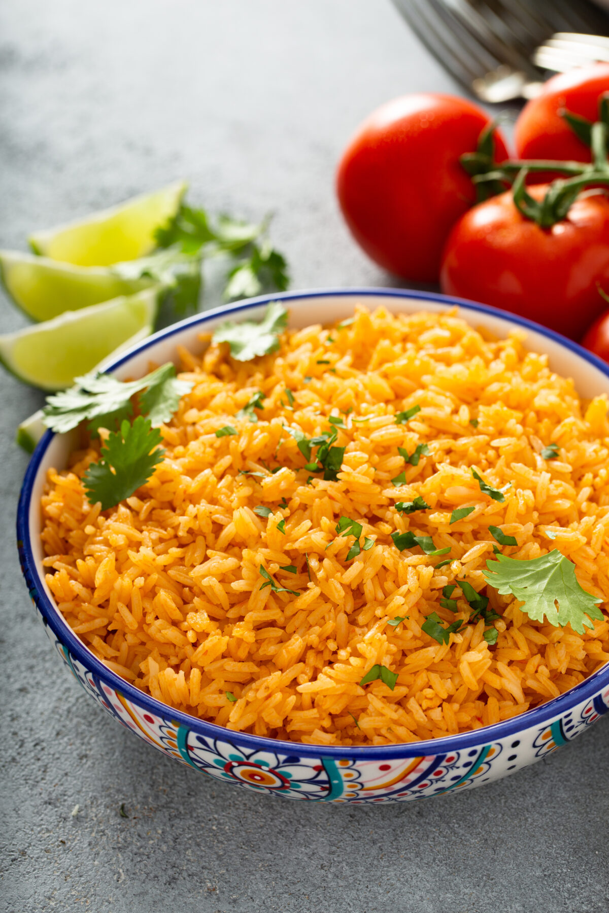 easy mexican rice with fresh cilantro in a colorful serving bowl