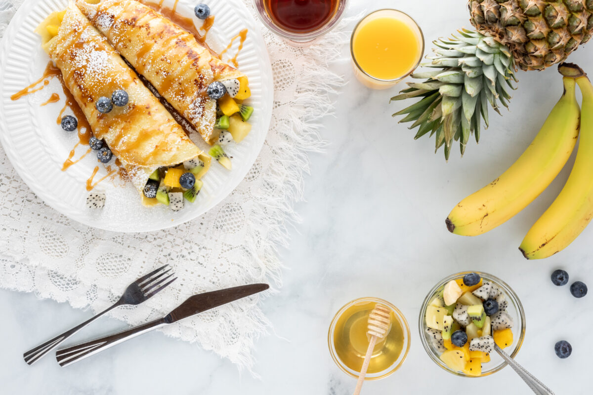 crepes with tropical fruit drizzled with honey