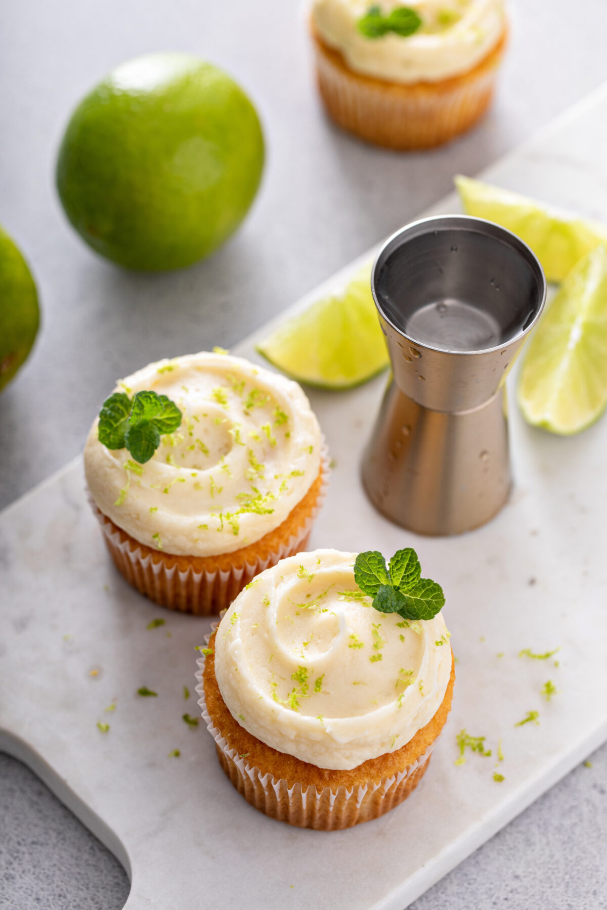 coconut lime cupcakes with lime zest and fresh mint