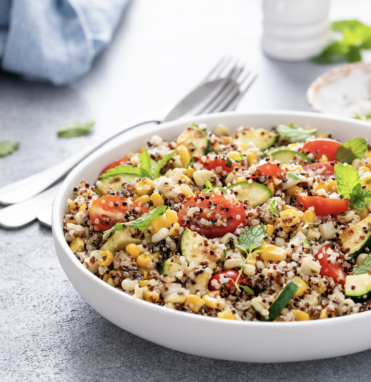 quinoa salad with fresh garden veggies in a serving bowl