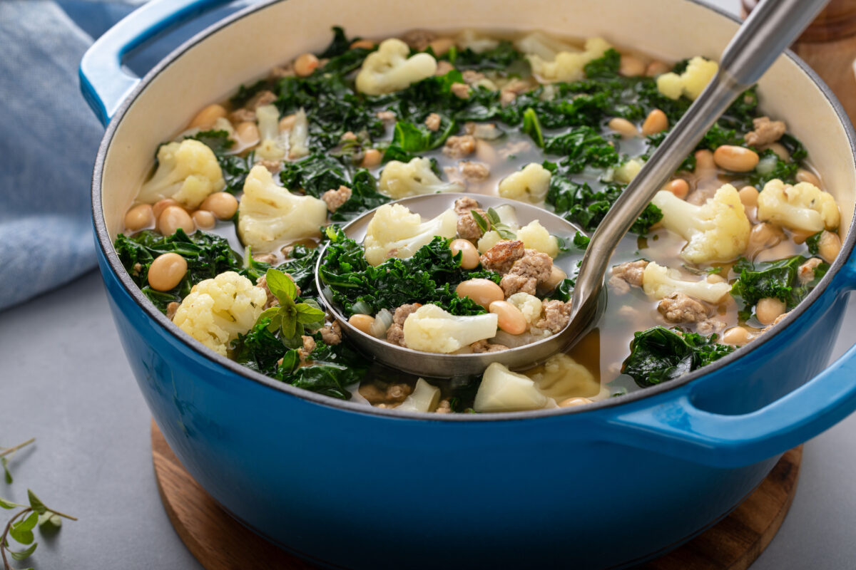 Healthy bean and ground turkey soup or stew with kale and cauliflower, low carb high protein soup idea, ready to be served with a laddle
