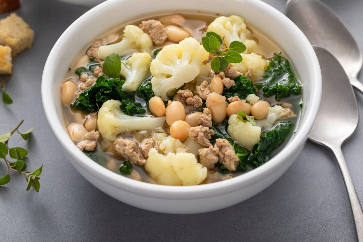 Healthy bean and ground turkey soup or stew with kale and cauliflower, low carb high protein soup idea, served in two bowls