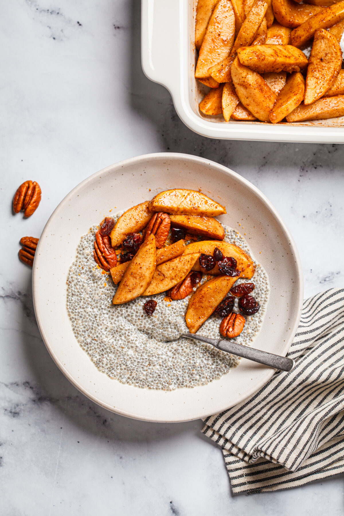 Chia pudding with caramelized apples, cinnamon, pecan and cranberries.