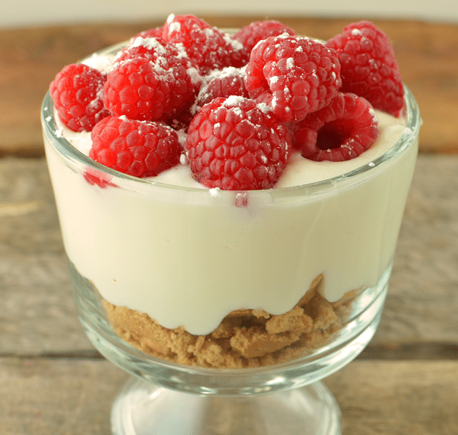 raspberry cheesecake dessert in a glass cup