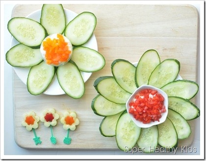 Cucumber flowers with pepper yogurt cheese spread. Strained yogurt makes a high protein dip, perfect for veggies like cucumbers!